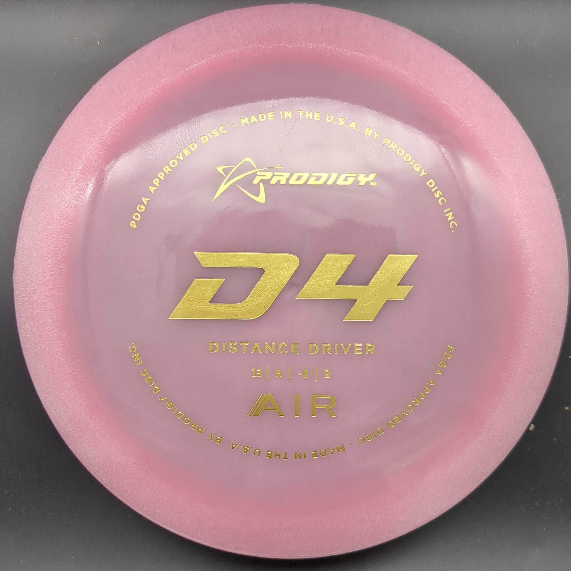 Prodigy Distance Driver Pink Gold Stamp 155g D4 - Air Plastic